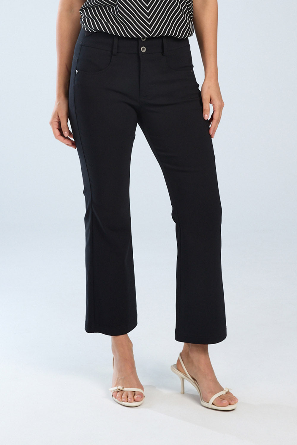 Person wearing black pants on a white background