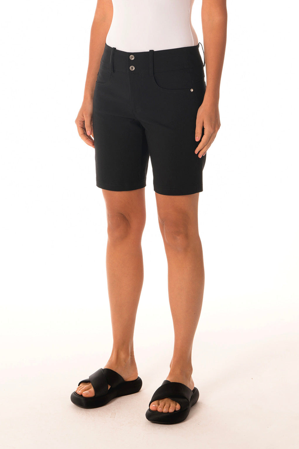 Person wearing black shorts on a white background