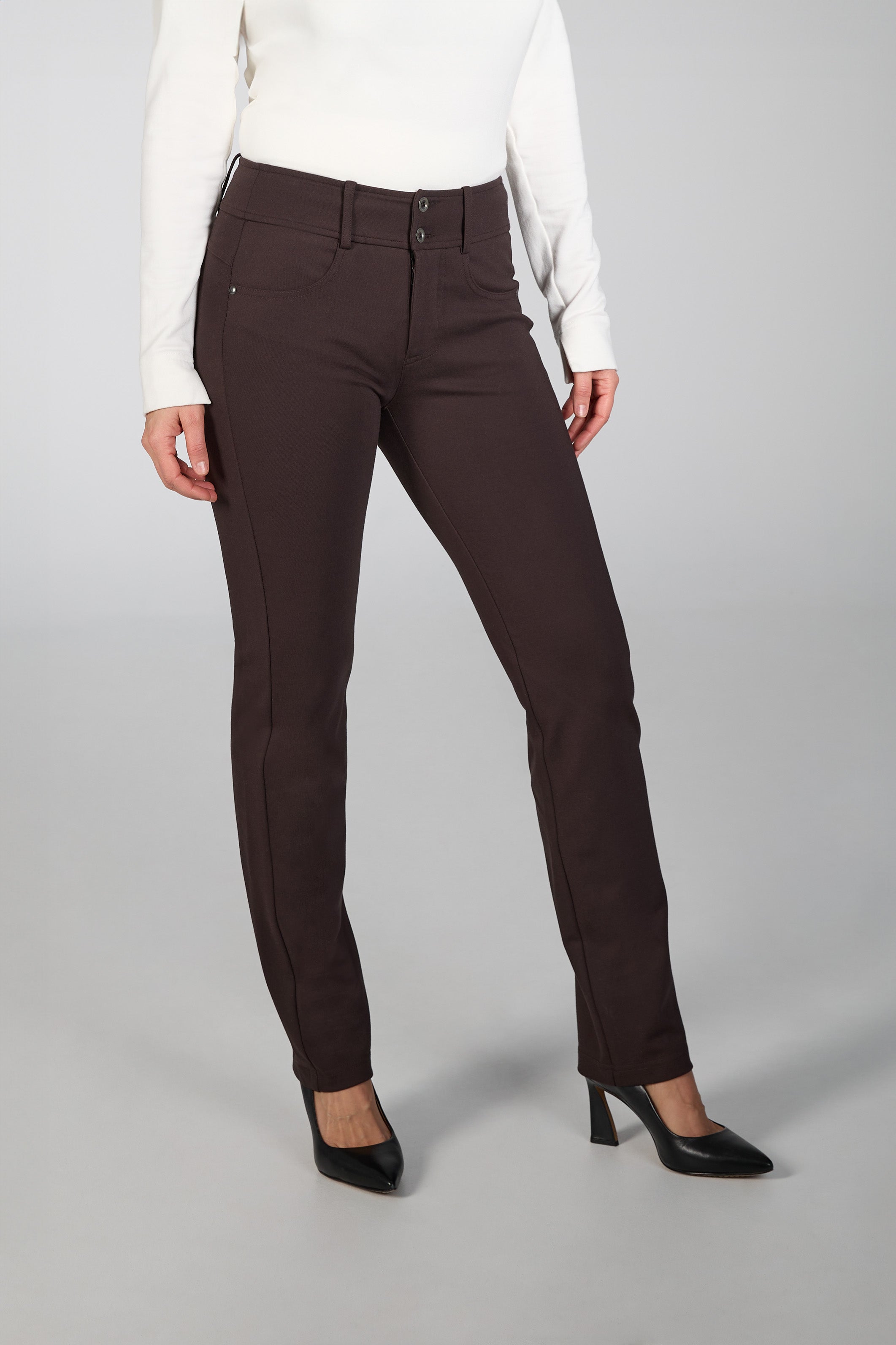 Brown pants worn by a person on a gray background