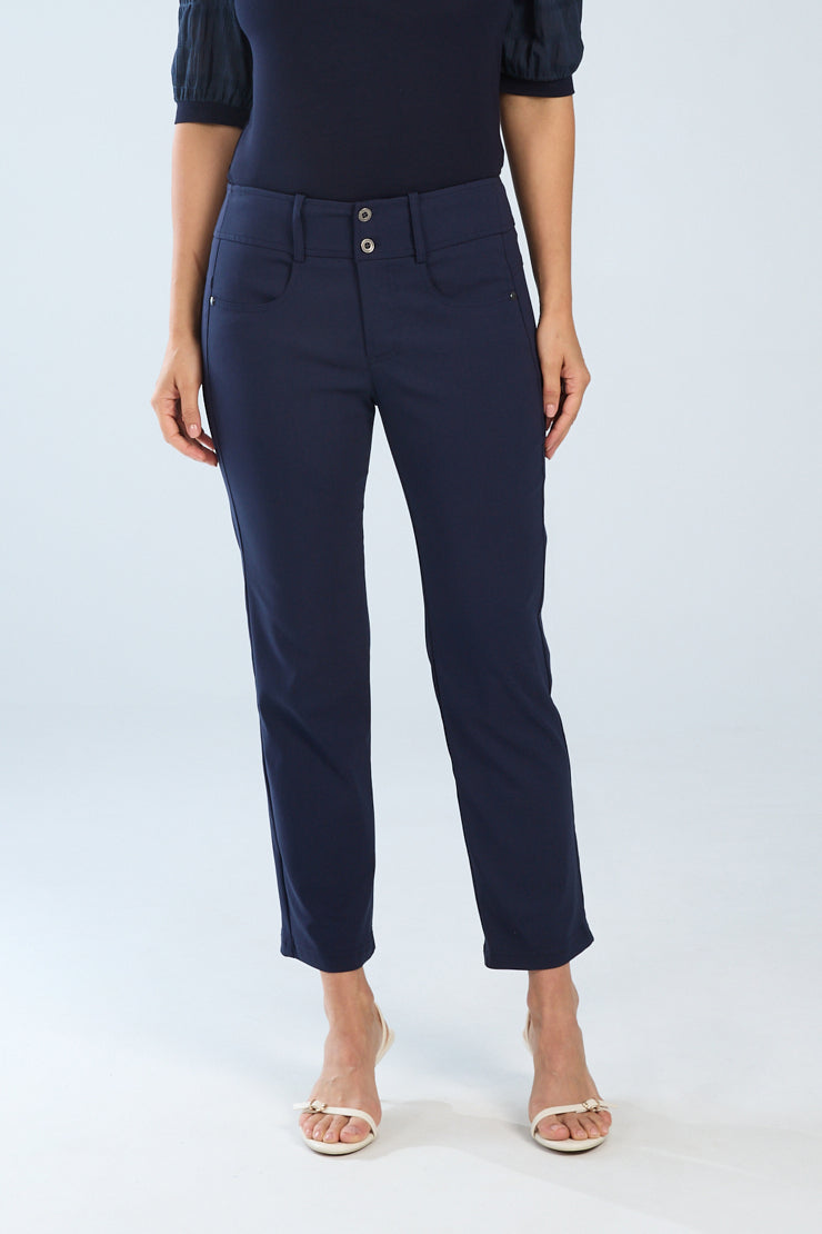 Person wearing navy blue pants on a white background