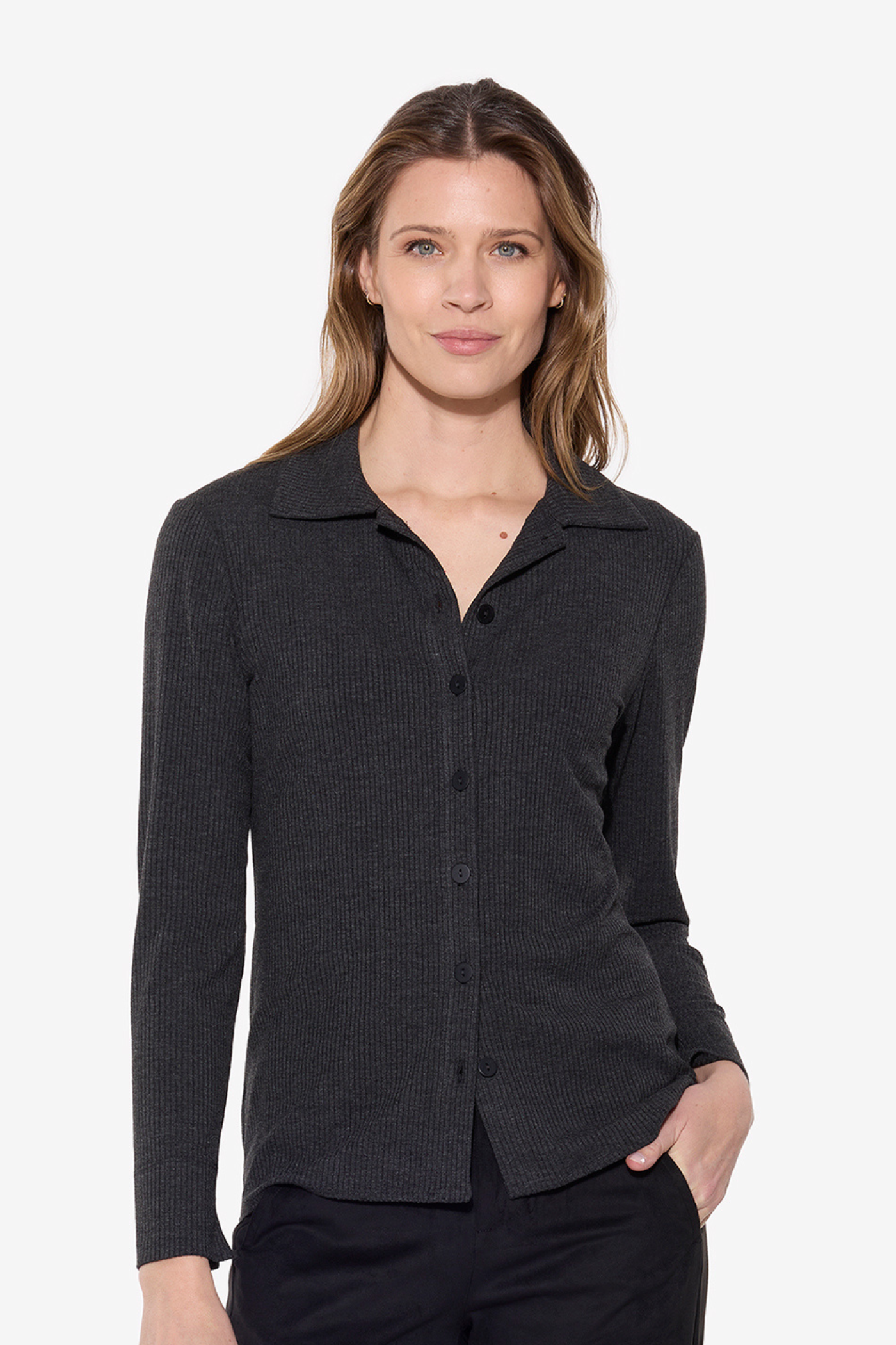 Woman wearing a dark gray button-up shirt on a white background
