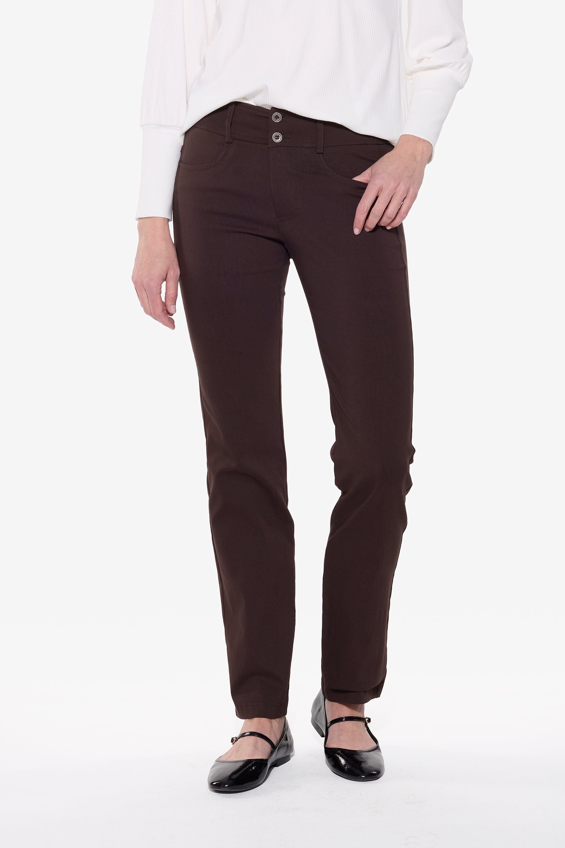 Brown pants worn by a person on a white background