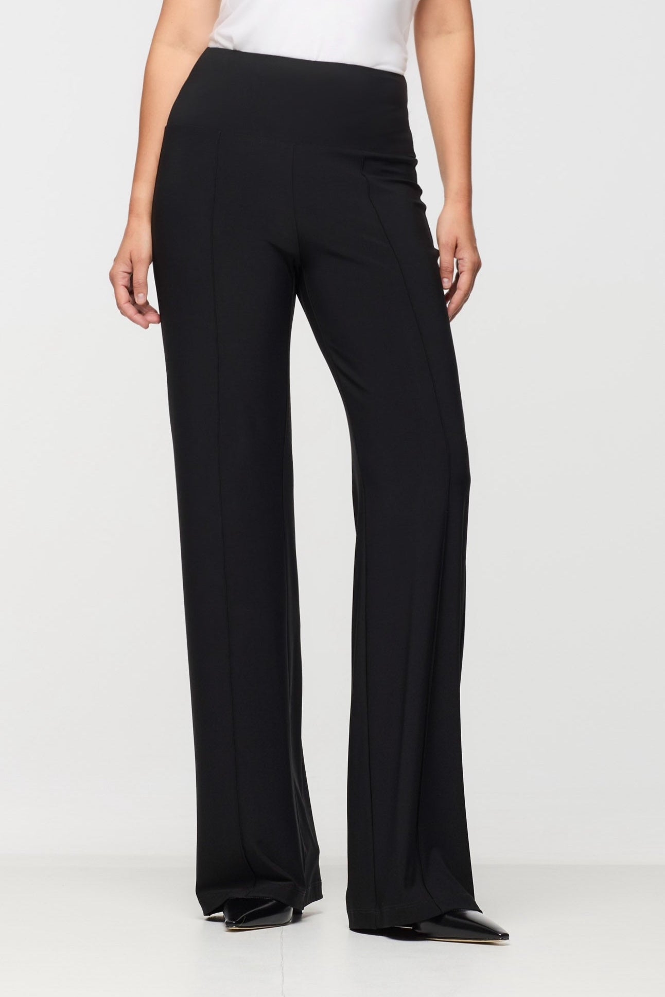 Black wide-leg pants worn by a person on a white background