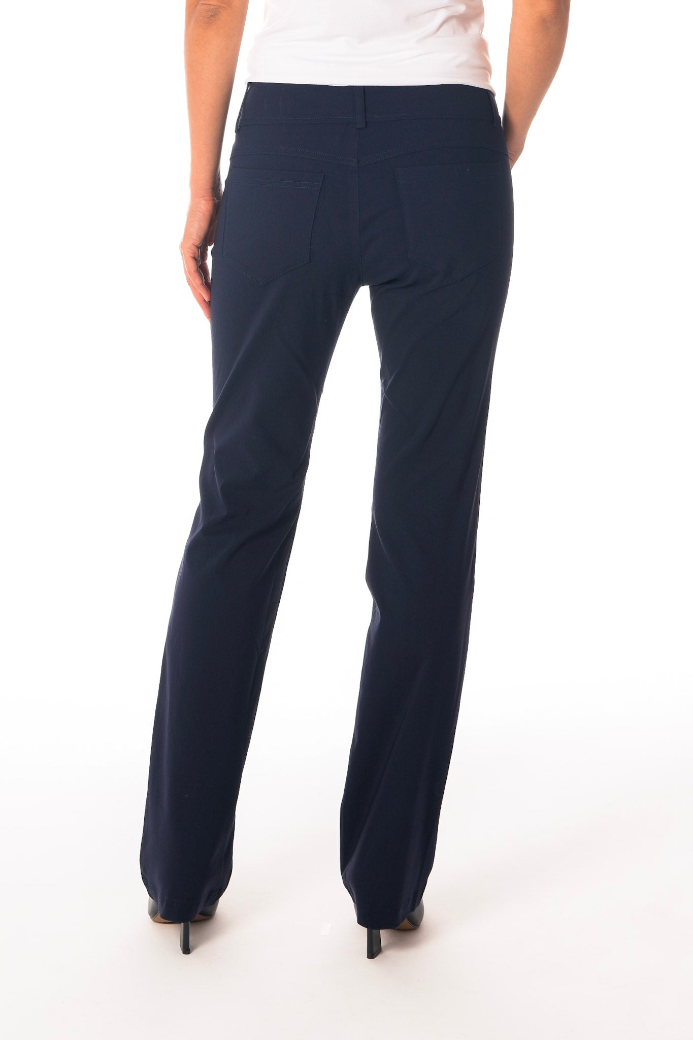 Navy blue pants worn by a person on a white background