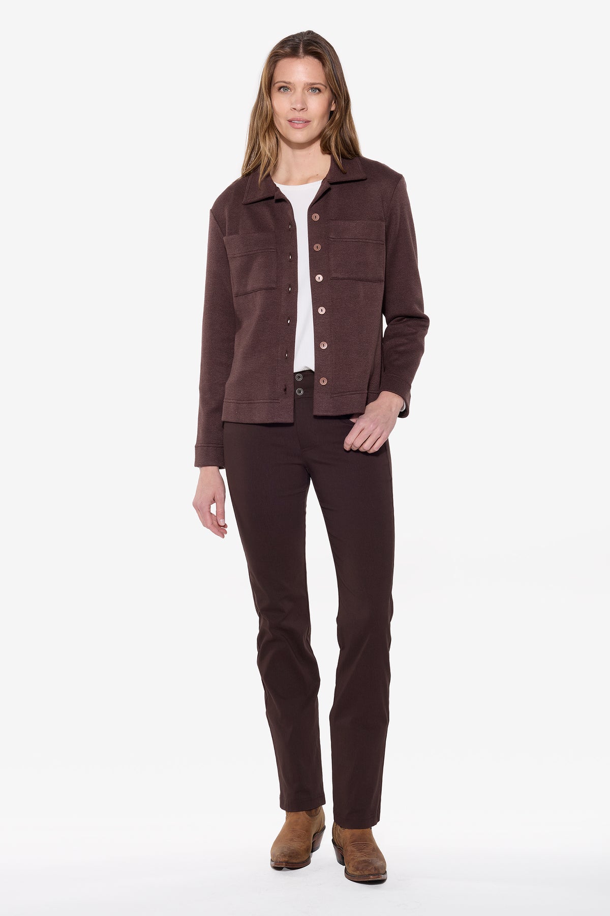 Woman wearing a brown jacket and pants on a white background