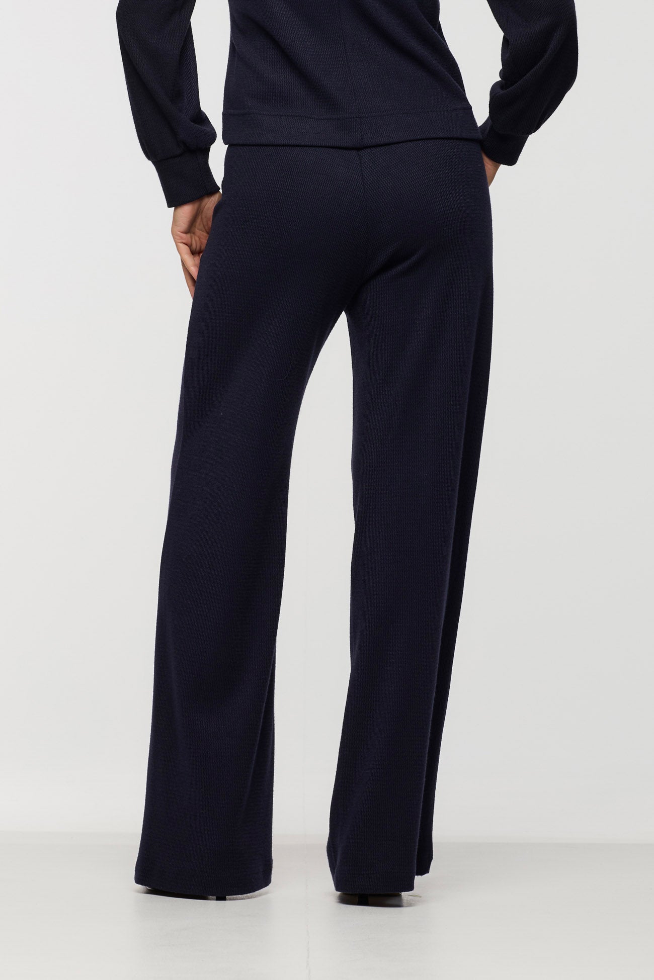 Back view of the BEDDOME Relaxed Wide Leg Pant in Navy, featuring a relaxed wide leg silhouette and clean pull-on design.