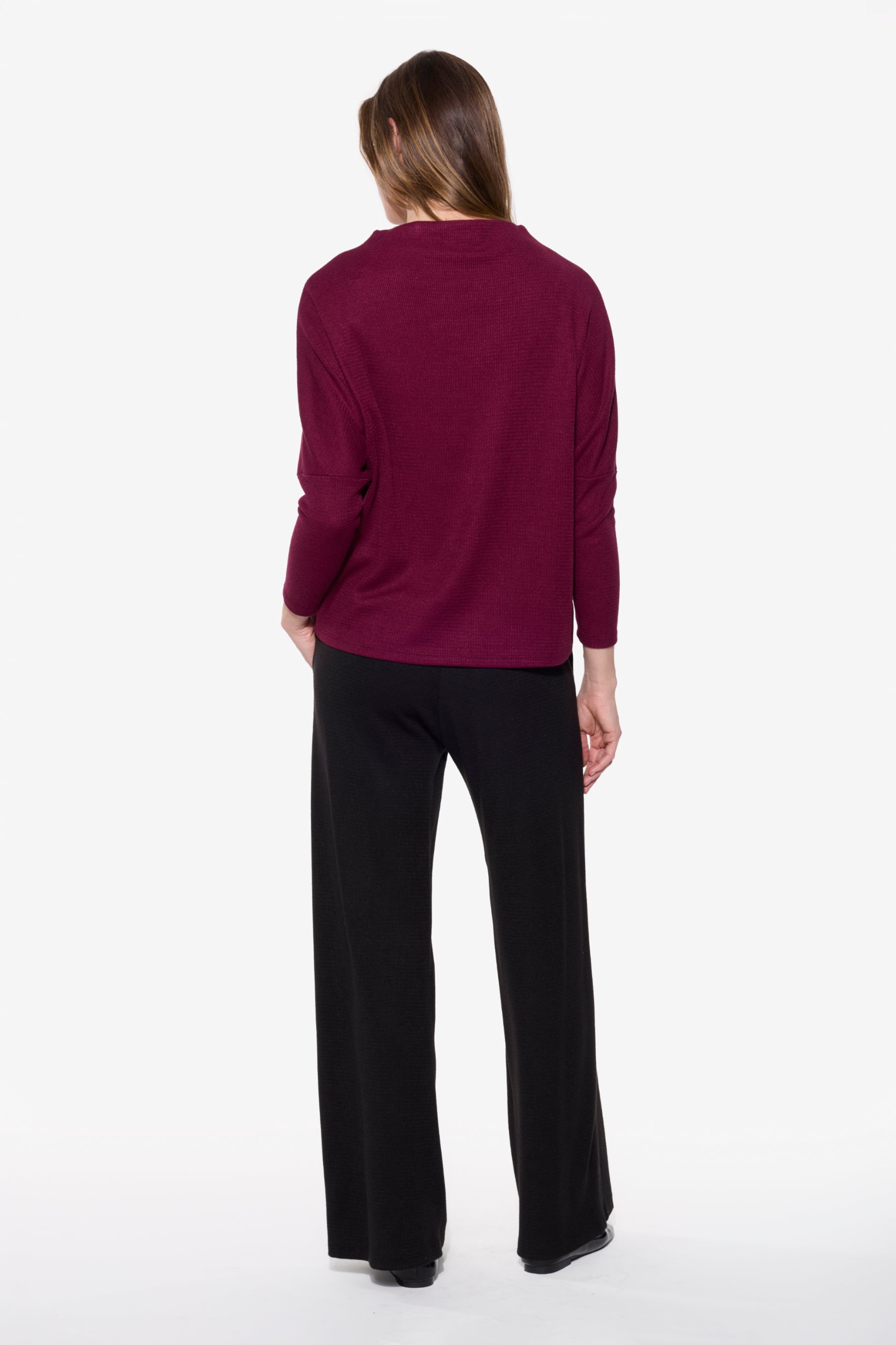 Back view of the BEDDOME Mock Neck Dolman Sweater in Burgundy, showcasing the relaxed fit and dolman sleeve design.