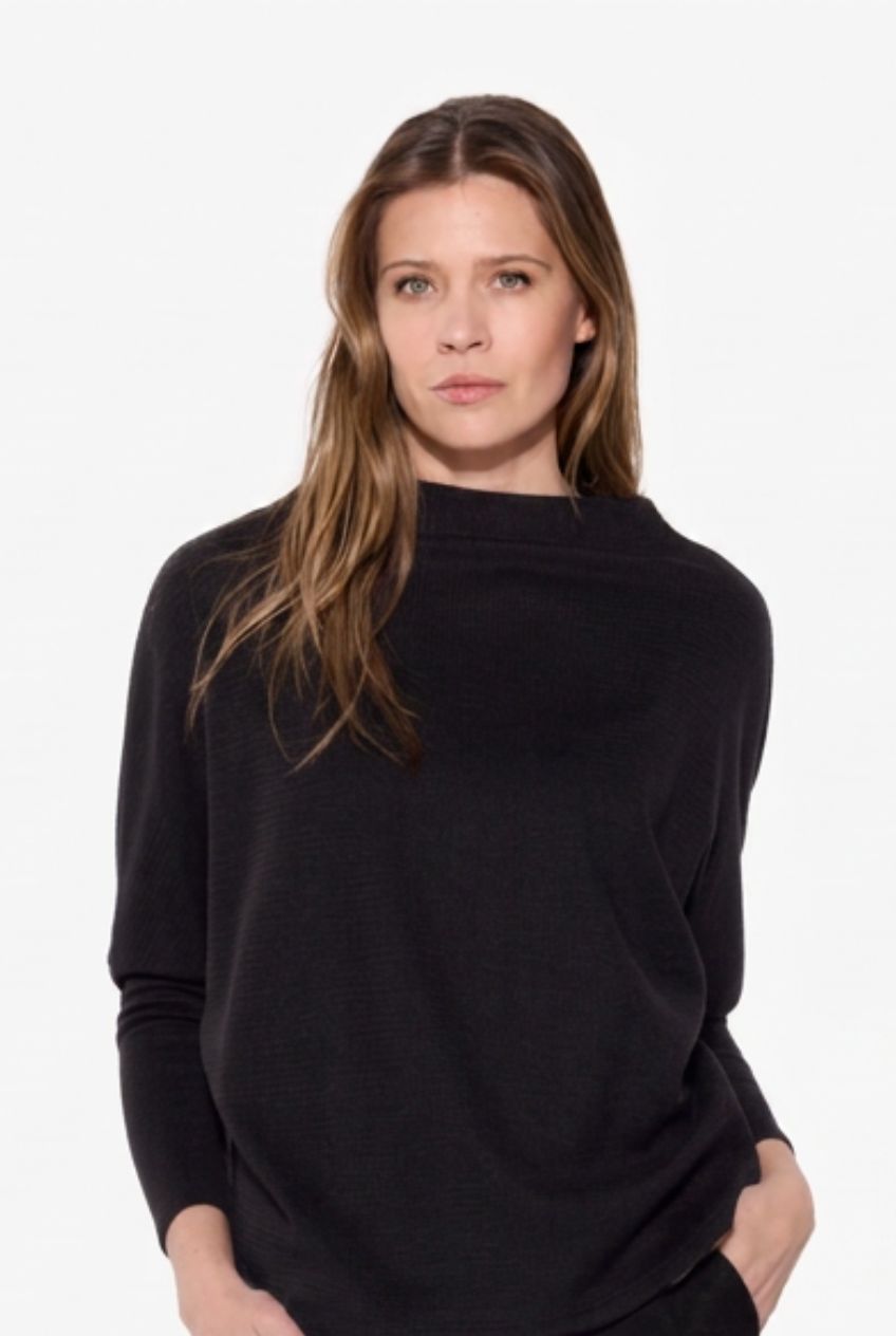 Model in Black Mock Neck Sweater