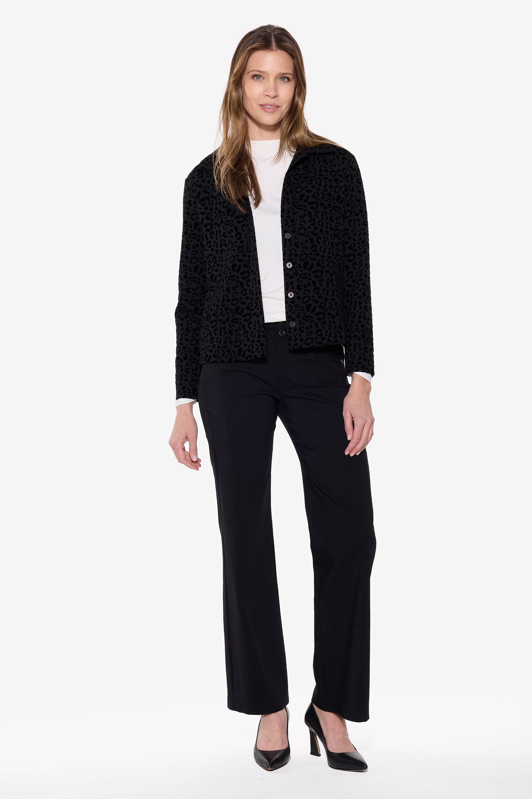 Woman wearing a black suit with a white shirt on a white background