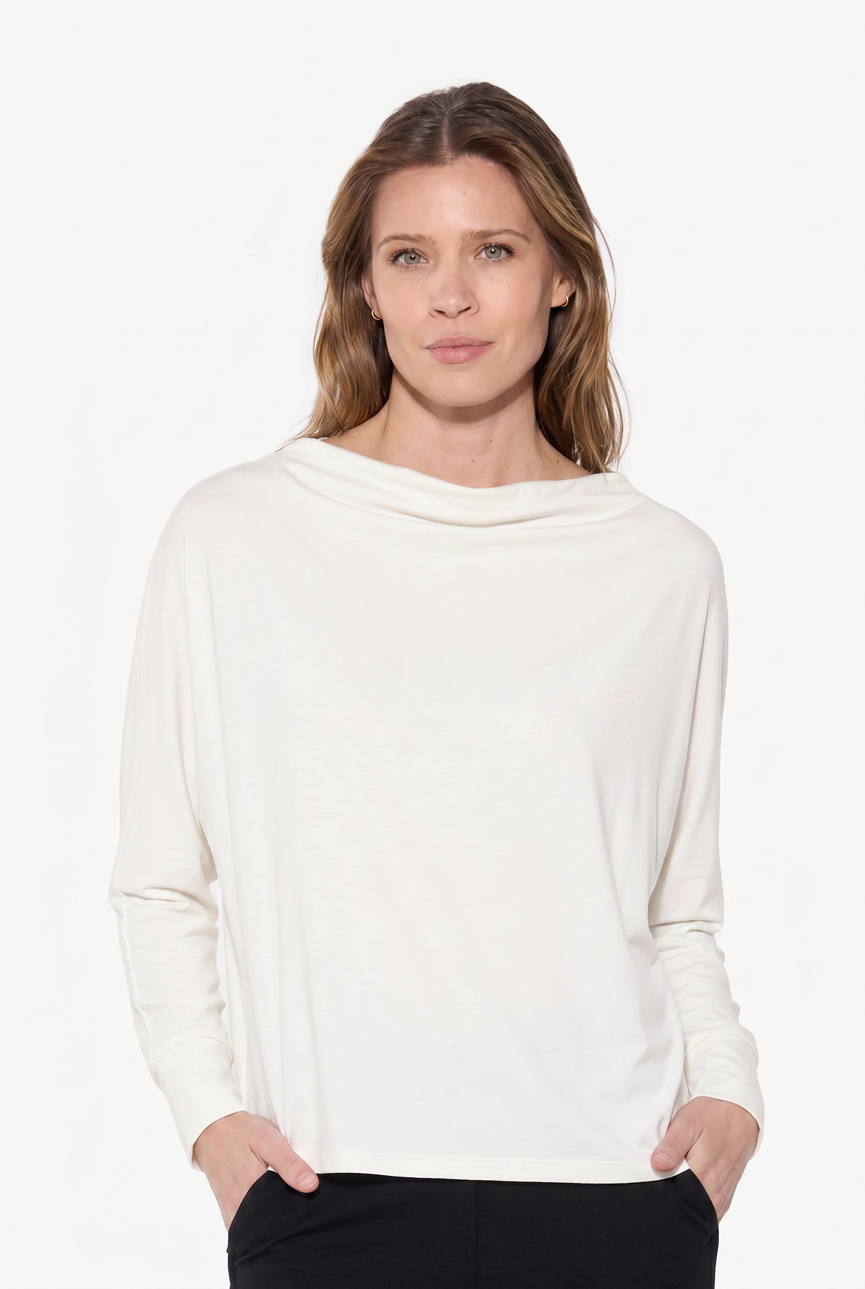 Woman wearing a white sweater on a white background