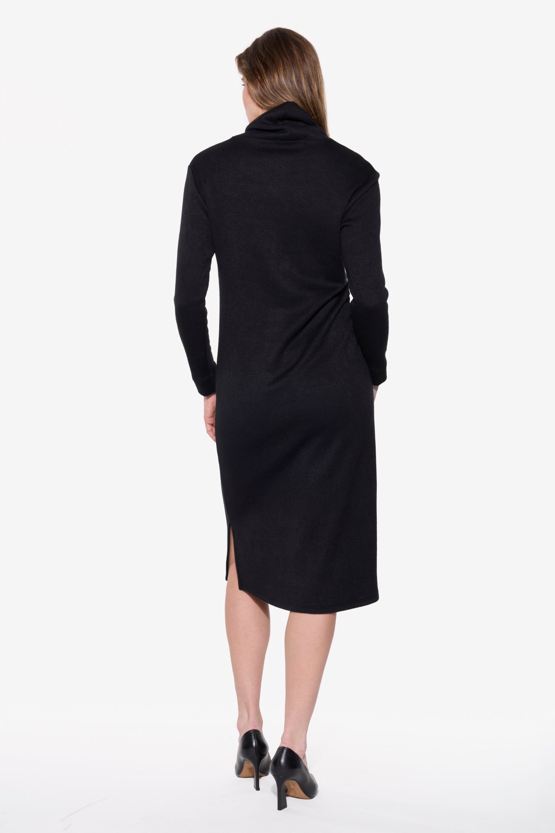 Black dress worn by a model on a white background