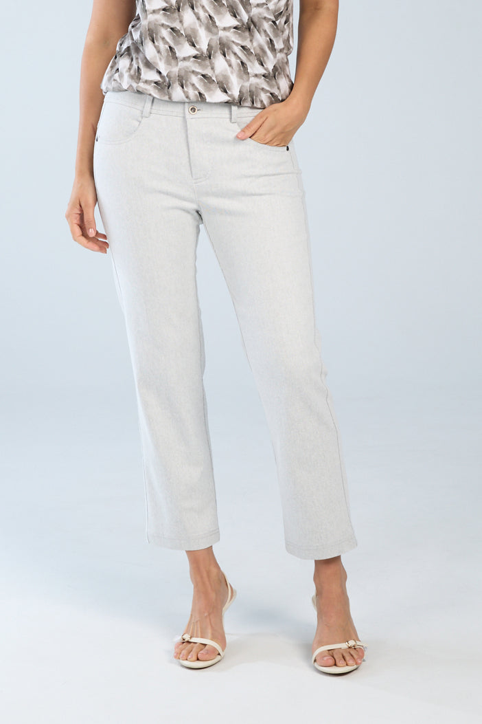Woman wearing stone-wash crop straight-leg jeans with a mid-rise waist, classic five-pocket styling, and cropped straight-leg silhouette.
