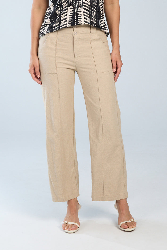 Woman wearing natural beige stretch linen cropped wide-leg pants with a mid-rise waist, front button closure, soft texture, and relaxed wide-leg fit.