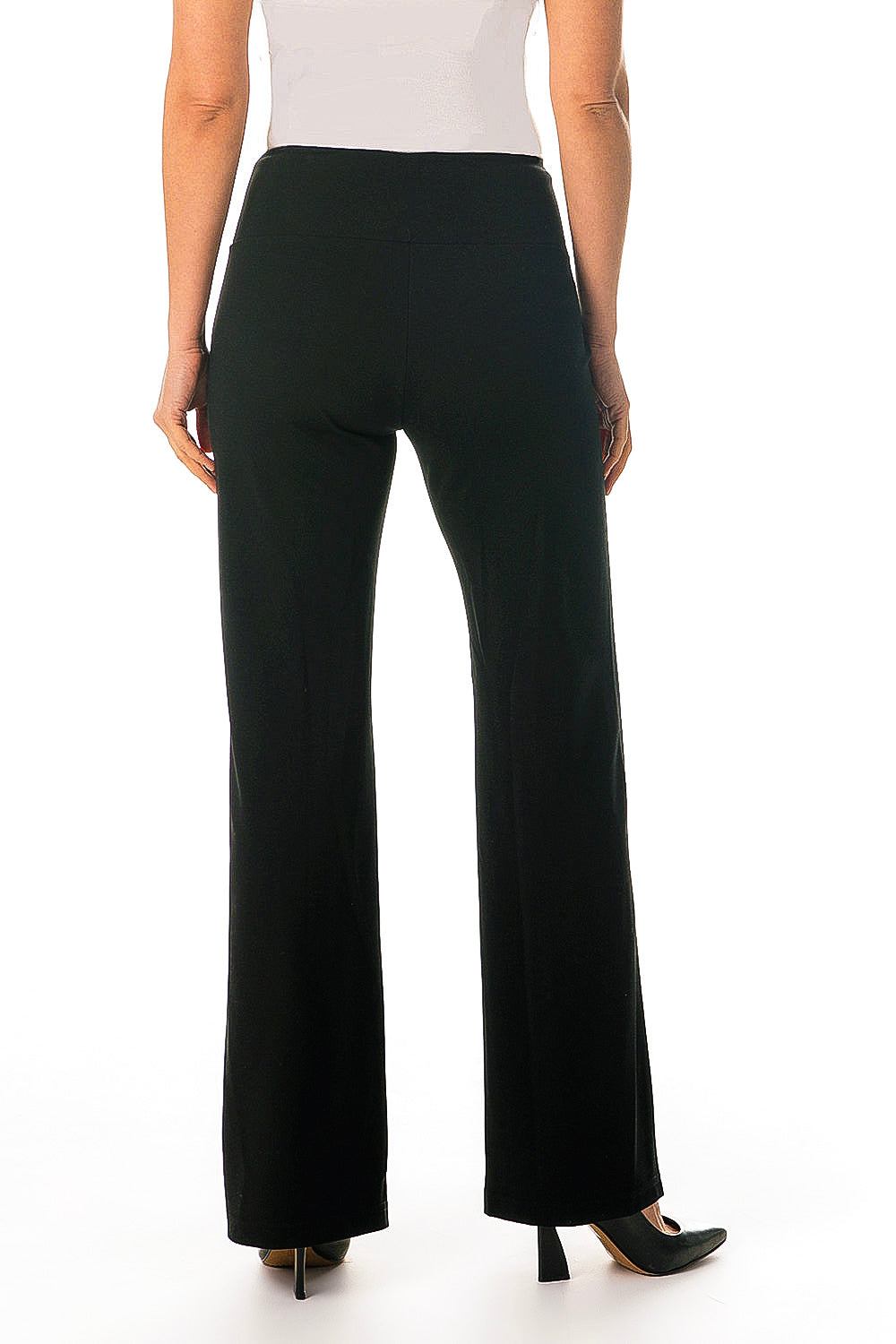 A model wearing black wide leg pintuck pants with a white top, standing against a plain background back view