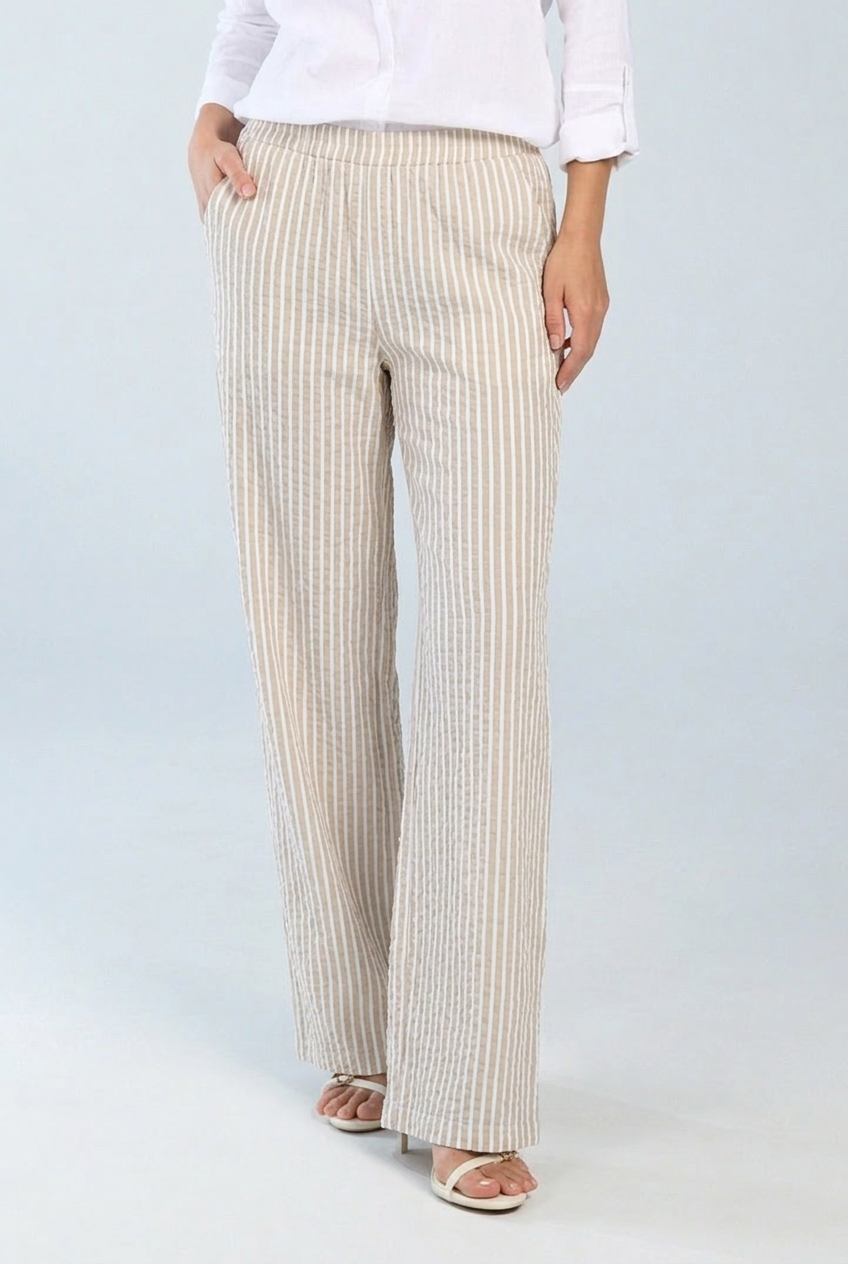 Person wearing beige striped pants and a white shirt on a light gray background
