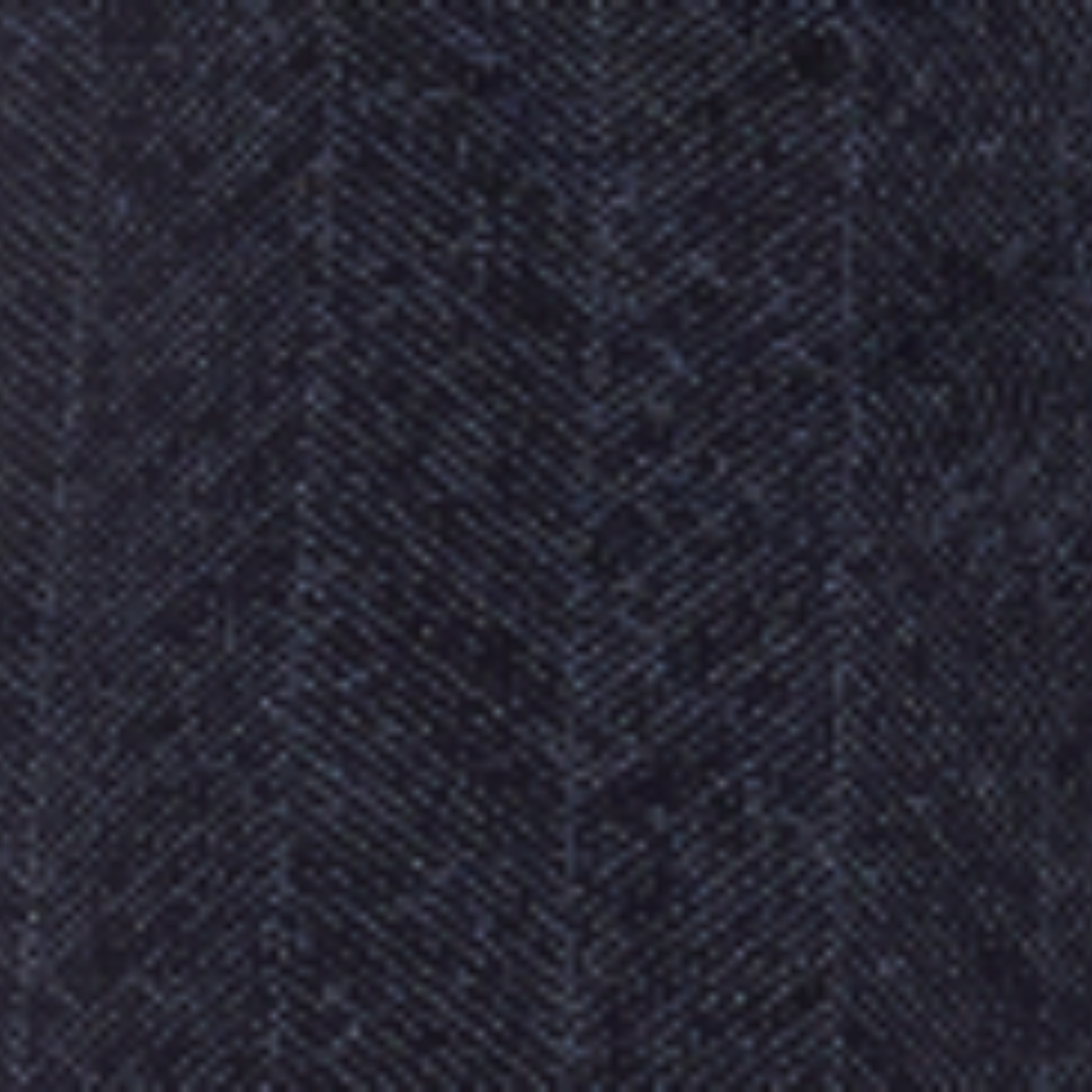 A close-up of black chevron patterned fabric texture.